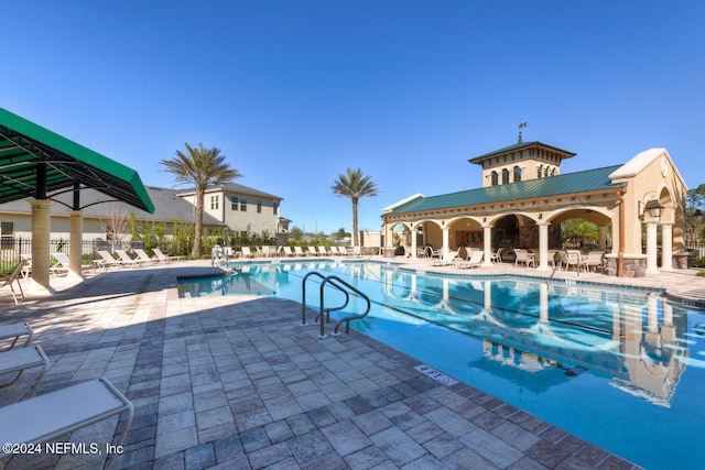 view of swimming pool with a patio