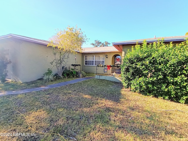 exterior space featuring a front lawn