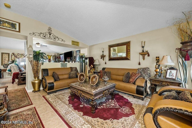 living room with lofted ceiling, light tile patterned floors, a textured ceiling, and ceiling fan