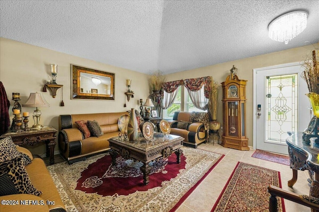 tiled living room with a textured ceiling and an inviting chandelier