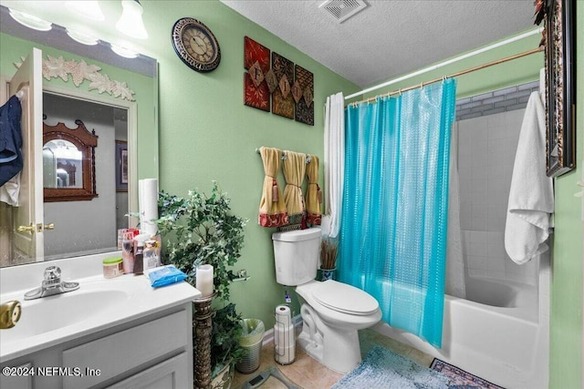 full bathroom with shower / bath combo, vanity, tile patterned flooring, toilet, and a textured ceiling