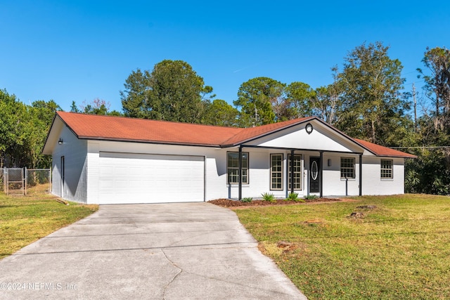 ranch-style home with a porch, a garage, and a front lawn