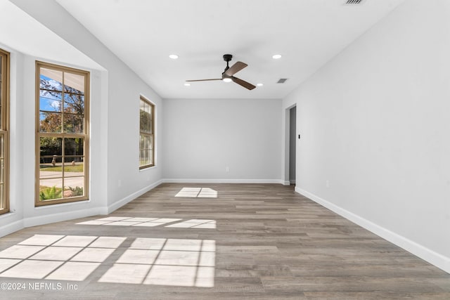 empty room featuring ceiling fan and light wood-type flooring