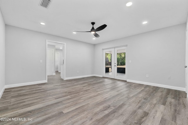 spare room featuring ceiling fan, french doors, and light hardwood / wood-style flooring