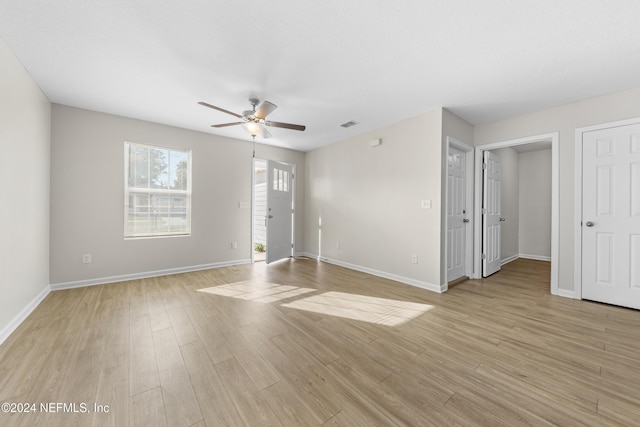 unfurnished room featuring ceiling fan and light hardwood / wood-style flooring