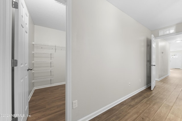 corridor featuring hardwood / wood-style floors