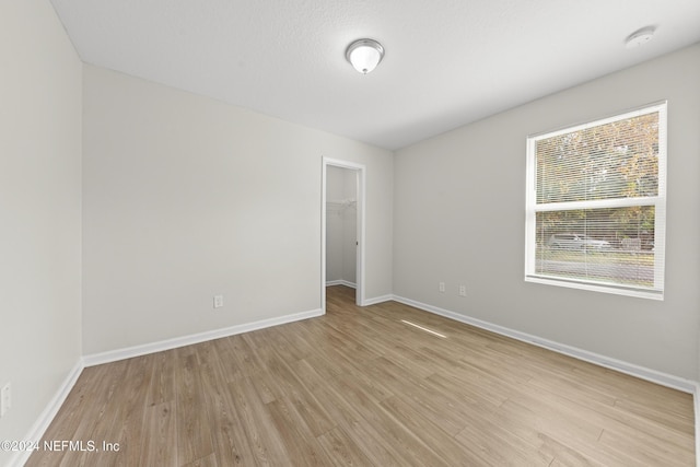 empty room with light wood-type flooring