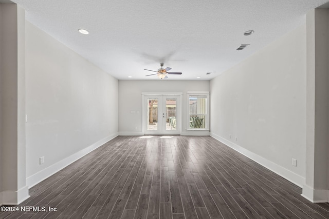 unfurnished living room featuring a textured ceiling, ceiling fan, dark hardwood / wood-style flooring, and french doors