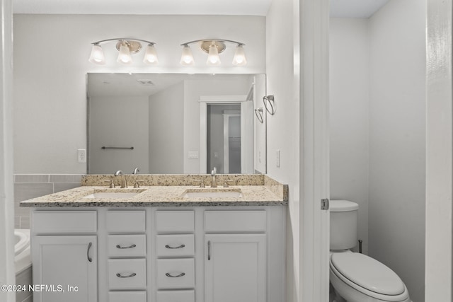 bathroom with vanity and toilet