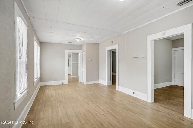 empty room with light hardwood / wood-style floors