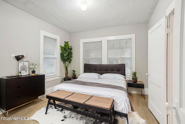 bedroom with light hardwood / wood-style floors