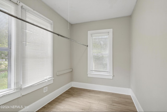 empty room with a healthy amount of sunlight and light wood-type flooring