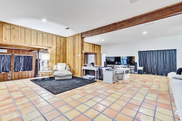 tiled living room with beamed ceiling and wood walls