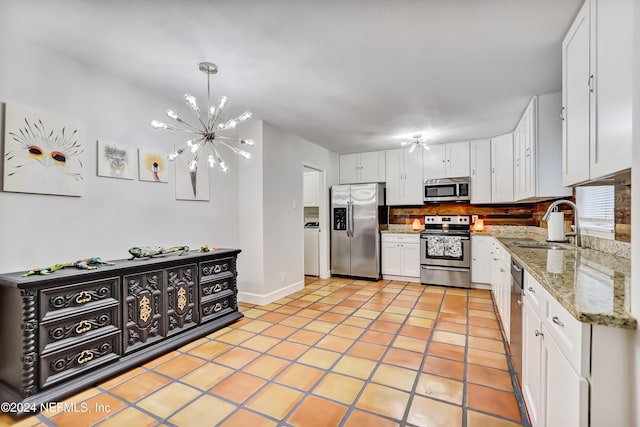 kitchen with white cabinetry, sink, and appliances with stainless steel finishes