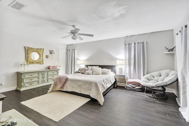 bedroom featuring dark hardwood / wood-style floors and ceiling fan