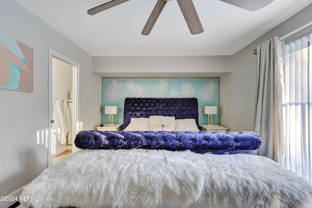 bedroom with connected bathroom and ceiling fan