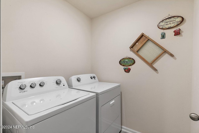 laundry room featuring separate washer and dryer