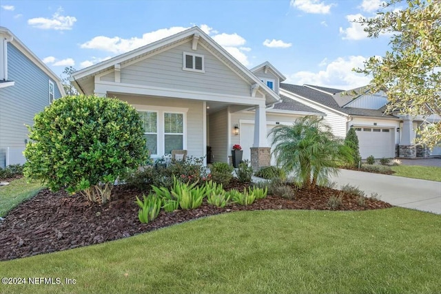 craftsman-style home with a front lawn