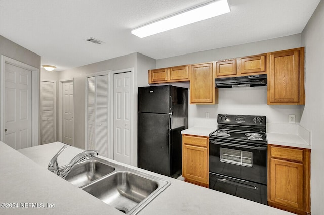 kitchen with sink and black appliances