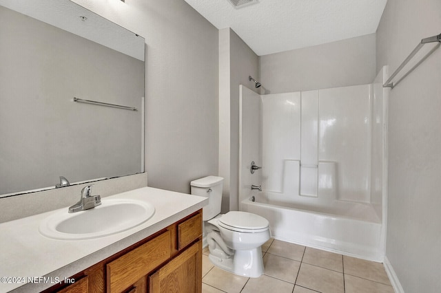 full bathroom featuring tile patterned floors, shower / bath combination, a textured ceiling, toilet, and vanity