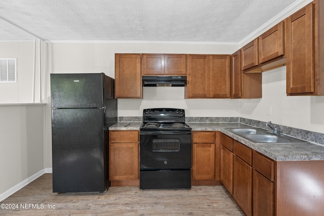 kitchen with black appliances, crown molding, sink, a textured ceiling, and light hardwood / wood-style floors