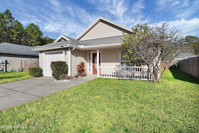 view of front of house with a garage and a front yard