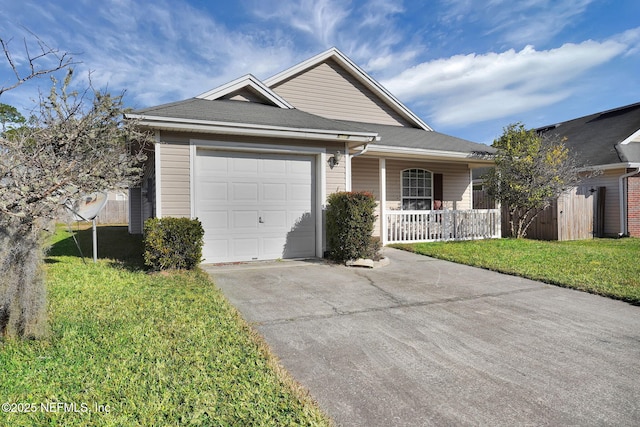 ranch-style house featuring a garage, a front lawn, and covered porch