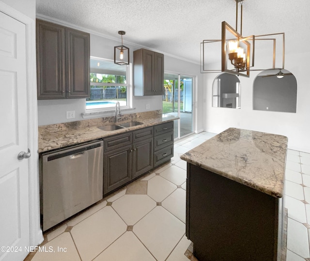 kitchen featuring sink, decorative light fixtures, stainless steel dishwasher, a textured ceiling, and dark brown cabinets