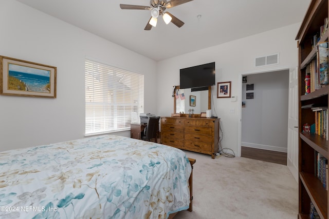 carpeted bedroom with ceiling fan