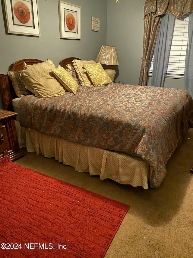 bedroom featuring carpet