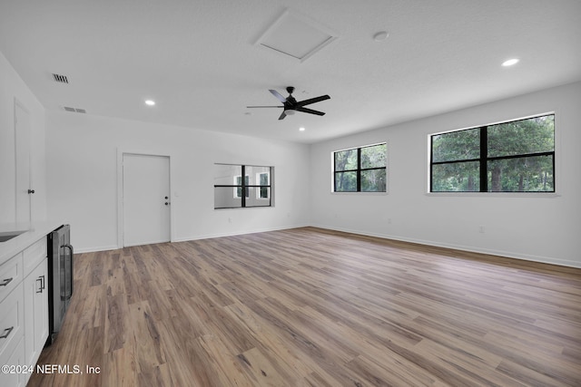 unfurnished living room with light wood-type flooring