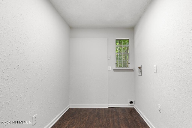 clothes washing area with dark wood-type flooring, washer hookup, and hookup for an electric dryer