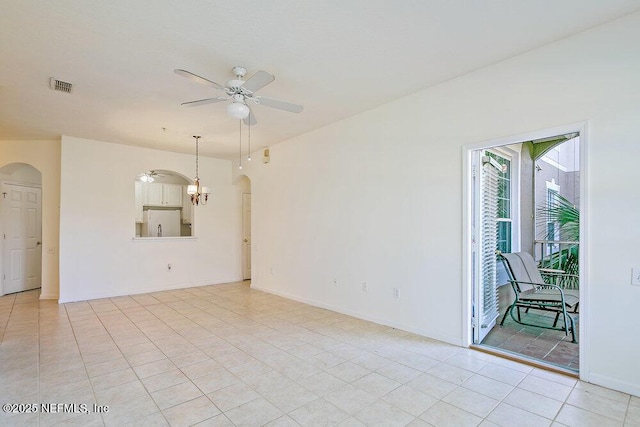 unfurnished room with light tile patterned flooring and ceiling fan