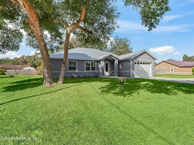 ranch-style home with a front yard and a garage