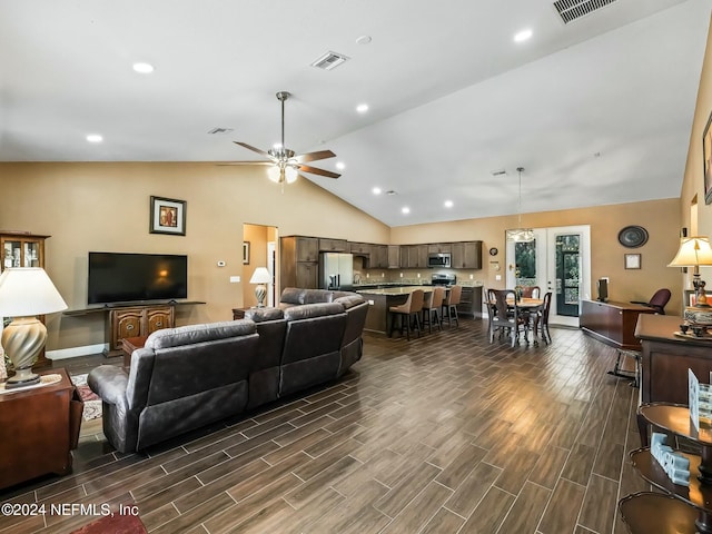 living room featuring ceiling fan, french doors, dark hardwood / wood-style floors, and lofted ceiling