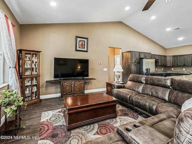 living room with ceiling fan, high vaulted ceiling, and dark hardwood / wood-style floors