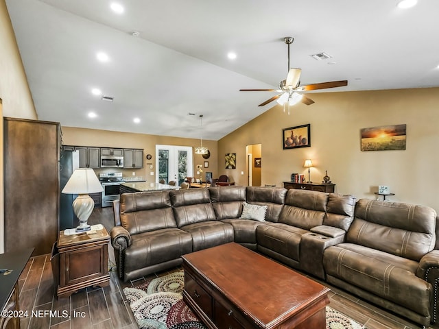 living room with french doors, ceiling fan, dark hardwood / wood-style flooring, and vaulted ceiling