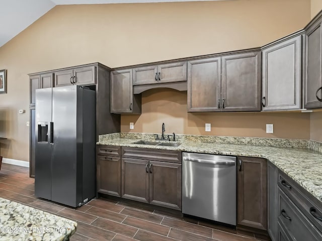 kitchen featuring dark brown cabinets, stainless steel appliances, and sink