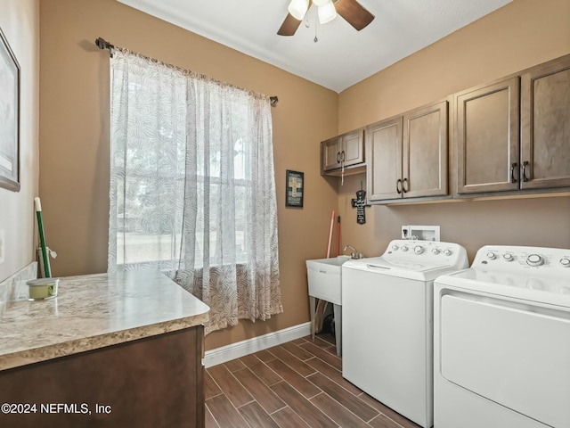 laundry area with dark hardwood / wood-style floors, ceiling fan, cabinets, and separate washer and dryer