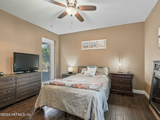 bedroom with ceiling fan and dark wood-type flooring