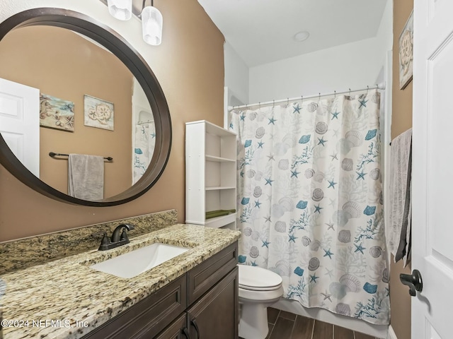 bathroom featuring hardwood / wood-style flooring, vanity, and toilet