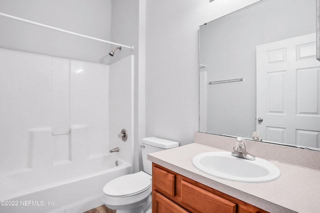 full bathroom with shower / tub combination, vanity, and toilet