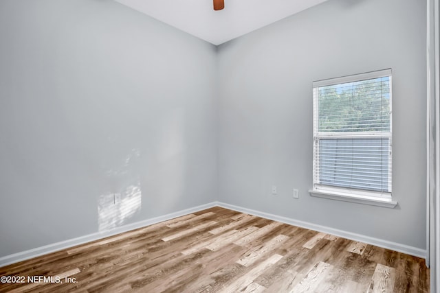 spare room with ceiling fan and light hardwood / wood-style flooring