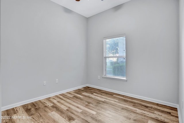 unfurnished room featuring light hardwood / wood-style flooring and ceiling fan