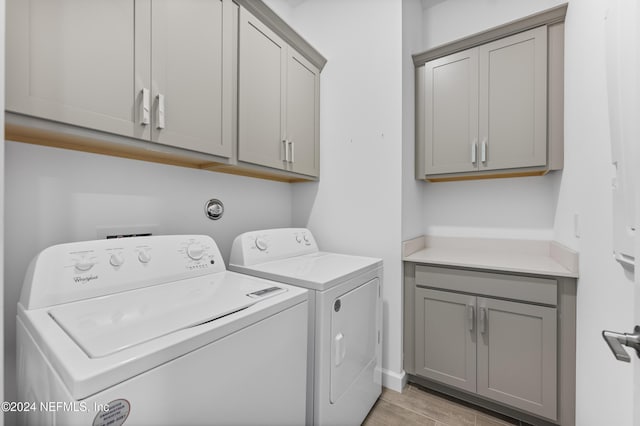 laundry area featuring cabinets and washer and dryer