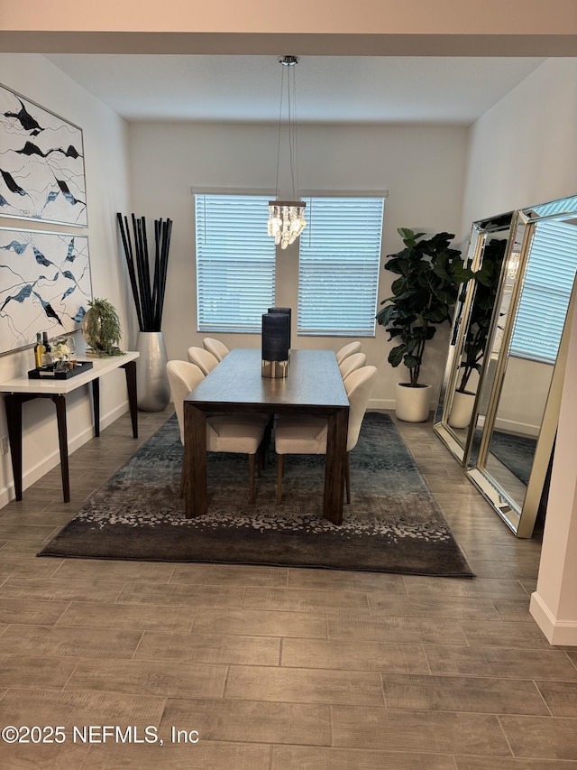 dining space featuring a notable chandelier