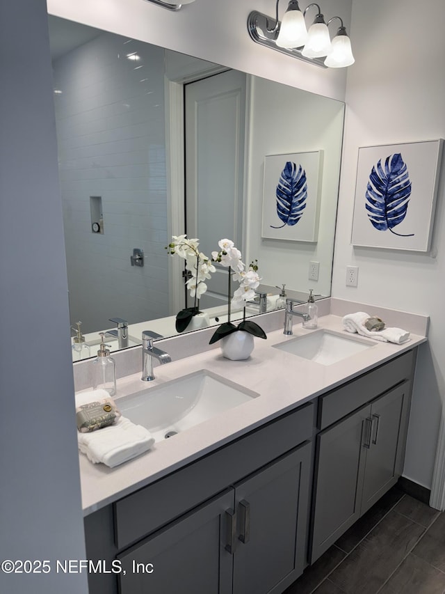 bathroom with vanity and tile patterned flooring