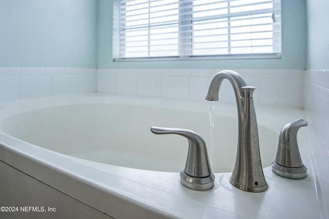 bathroom featuring plenty of natural light and sink