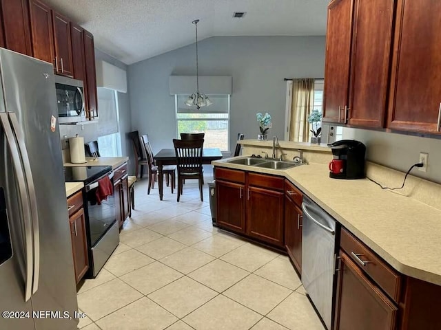 kitchen with sink, hanging light fixtures, vaulted ceiling, a notable chandelier, and stainless steel appliances