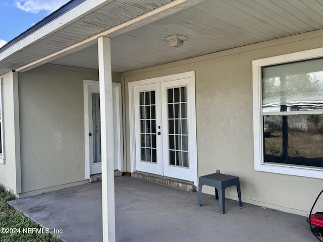 property entrance with french doors and a patio area